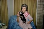 Woman with her Chihuahua Dog, feeding, treat, 1950s, ADSV04P08_04