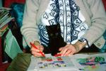 Black Cat on grandmas lap, puzzle, hands, AFCV04P02_13