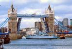 HMS Belfast (C35), Royal Navy light cruiser, Tugboat, Tower Bridge, London, River Thames, CEEV04P01_04.2583