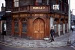 Ryrie's Bar, Ryrie & Co., Edinburgh, Man walking his dog, sidewalk, curb, doorway, windows, Scotland, CEEV05P01_17