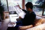 Man reads the morning newspaper, ENCV01P03_04