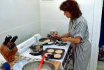 Stove, woman cooking, frying pan, knives, pancakes, breakfast, 1980s, FDNV01P04_05