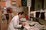 Doctor late at night, telephone, rolodex, file folders, HEPV01P05_03