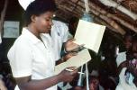 Nurse, Weighing a Toddler, Rushinga Zimbabwe, HOFV01P05_11