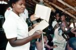 Nurse, Weighing a Toddler, Rushinga Zimbabwe, HOFV01P05_12