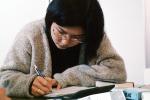 Woman, studying, classroom, books, writing, KECV02P14_08