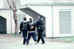 Police arrest a boy, handcuffed, Policeman, Operation Kernel Blitz, urban warfare training, MYMV02P12_15