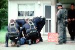 Police arrest a boy, resisting arrest, handcuffed, Policeman, Operation Kernel Blitz, urban warfare training, MYMV02P13_01