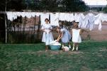 Mother and Daughters hanging laundry to dry, 1950s, PDLV01P10_05