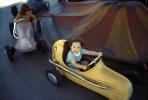 Kiddie ride, racing cars, girl, cute, 1950s, PFFV04P04_18