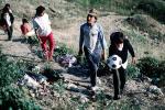 Boys, walking, soccer ball, trash, Colonia Flores Magone, PFSV02P02_09