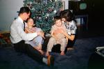 Christmas Tree decorated, decorations, woman sitting, boys, father mother, retro, 1940s, PHCV01P10_17