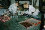 Boys playing with their new Christmas toys, army, presents, pajamas, 1950s, PHCV01P12_11