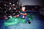 boy, tree, blow-up alligator, Christmas Morning, 1960s, PHCV02P13_11