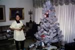 Tree, Frosted, Woman, Smiles, Happy, Apron, Presents, Decorations, Ornaments, drapes, curtain, 1960s, PHCV03P06_09