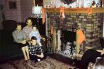 woman, man, girl, boy, daughter, son, stockings, mantle, ribbons, lamp, Fireplace, Family, 1940s, PHCV03P11_18