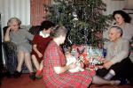 Opening Presents, Gifts, tinsel, baby, grandma, grandmother, mother,  1950s, 1950s, PHCV03P14_11