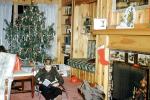 boy reading, fireplace, sitting, Tree, Presents, Gifts, Decorations, Ornaments, 1950s, PHCV04P06_05