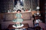Woman, sofa, dress, coffee table, Tree, Presents, Gifts, Decorations, Ornaments, 1950s, PHCV04P07_17