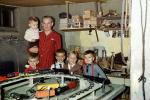 Boys with their Christmas model train set, basement, 1950s, PHCV04P14_16