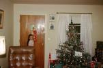 Happy girl with her stocking, door, decorated tree, 1950s, PHCV05P02_15