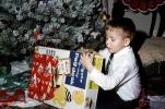 Holgate Page Desk, Boy Opening Present, tree, tie, December 1964, PHCV05P07_01
