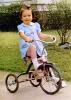 Tricycle, Girl Peddling, formal dress, sidewalk, 1950s, PLGV03P12_01B