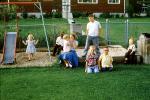 Backyard, sandbox, boys, girls, slide, July 1958, 1950s, PLGV03P15_01