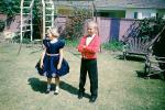 Backyard, boy, girl, dressy, formal dress, smiles, April 1960, 1960s, PLGV03P15_07