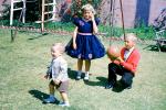 Girl, boy, ball, formal dress, Backyard, April 1960, 1960s, PLGV03P15_08B