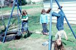 swingset, upside down, girls, backyard, April 1979, 1970s, PLGV04P01_06