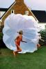 Playing with a Parachute, girl, running, barefoot, lawn, 1960s, PLGV04P01_07C