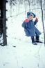 Girl on a Swing in the middle of winter, snow, cold, coat, mittens, 1950s, PLGV04P02_03