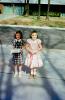 Birthday presents, girls, sidewalk, dress, smiles, smiling, 1940s, PLPV16P07_04