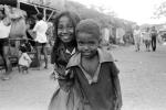 Girl smiles, boy smiling, shanty town, slum, Mumbai, India, POVPCD3306_089