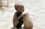 Boy eating from a bowl, Lake Turkana, refugee, African Diaspora, POVV01P07_01