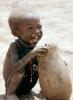Boy eating from a bowl, Lake Turkana, refugee, African Diaspora, POVV01P07_01B
