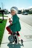 Girl learning to ride a bike, training wheels, helmet, headgear, SBYV03P06_10