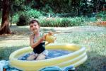 Backyard Swimming pool, Girl, Smiles, Lawn, 1960s, SWFV02P06_08