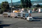 San Francisco International Airport (SFO), ground personal, carts, baggage tractors, TAAV02P01_08.1694
