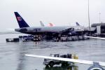 N228UA, United Airlines UAL, Boeing 777-222ER, (SFO), rain, inclement weather, wet, TAFV14P02_08