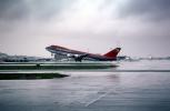 Boeing 747 taking-off, (SFO), rain, inclement weather, wet, TAFV14P04_13