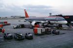 Boeing 757, Northwest Airlines NWA, ground personal, carts, baggage tractor, Gate F10, TAFV22P14_19