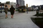 Woman waking, Cable Car Turnaround, stores, buildings, Hyde Street, February 1968, 1960s, VRCV02P11_10