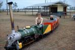 Boy as Train Engineer, girls, brother, sister, Miniature Train, April 1962, 1960s, VRPV08P12_17